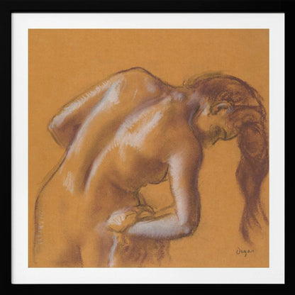 A framed pastel sketch by Edgar Degas titled 'After the Bath, Woman Drying Herself'. The artwork depicts a nude woman from the back, bending forward as if drying herself. The drawing is on a warm ochre-colored paper, with her form defined by brown lines and white highlights, especially along her spine and shoulders. Her long brown hair cascades down on the right side. Wall Art