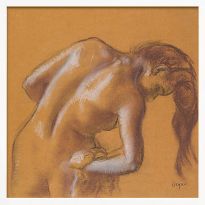 A framed pastel sketch by Edgar Degas titled 'After the Bath, Woman Drying Herself'. The artwork depicts a nude woman from the back, bending forward as if drying herself. The drawing is on a warm ochre-colored paper, with her form defined by brown lines and white highlights, especially along her spine and shoulders. Her long brown hair cascades down on the right side. Wall Art