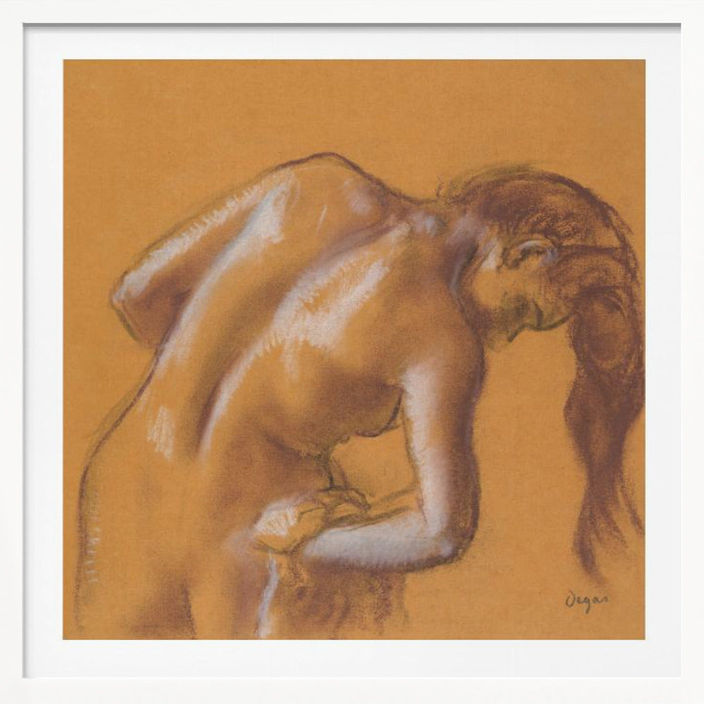 A framed pastel sketch by Edgar Degas titled 'After the Bath, Woman Drying Herself'. The artwork depicts a nude woman from the back, bending forward as if drying herself. The drawing is on a warm ochre-colored paper, with her form defined by brown lines and white highlights, especially along her spine and shoulders. Her long brown hair cascades down on the right side. Wall Art