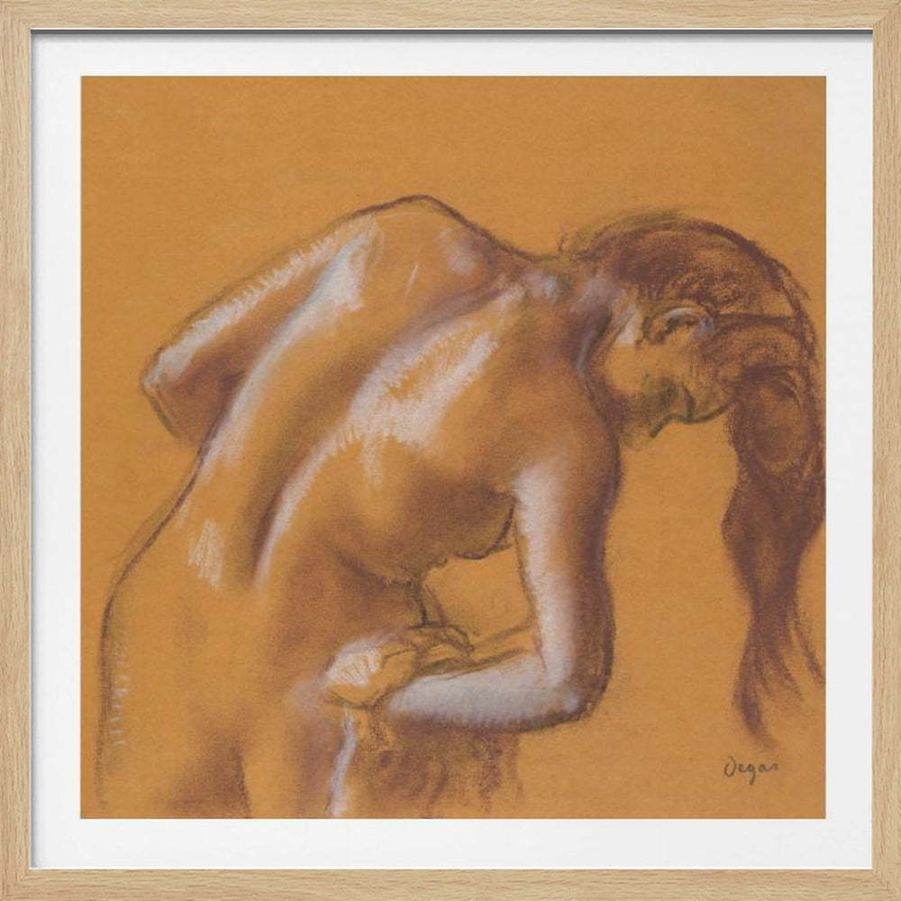 A framed pastel sketch by Edgar Degas titled 'After the Bath, Woman Drying Herself'. The artwork depicts a nude woman from the back, bending forward as if drying herself. The drawing is on a warm ochre-colored paper, with her form defined by brown lines and white highlights, especially along her spine and shoulders. Her long brown hair cascades down on the right side. Wall Art