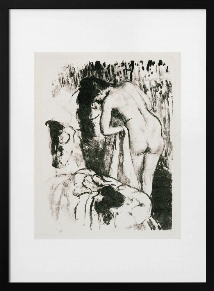 A framed black and white lithograph by Edgar Degas of a nude woman with long dark hair, viewed from the back as she leans over. The artwork has a sketchy, impressionistic style, capturing an intimate moment. Wall Art