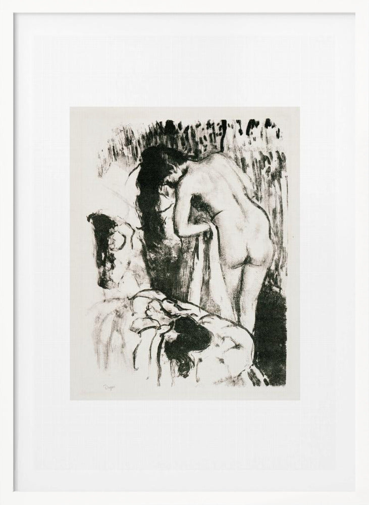 A framed black and white lithograph by Edgar Degas of a nude woman with long dark hair, viewed from the back as she leans over. The artwork has a sketchy, impressionistic style, capturing an intimate moment. Wall Art