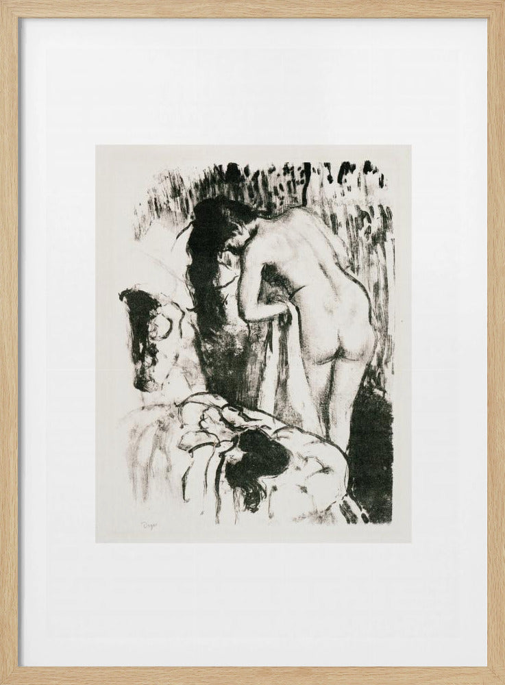 A framed black and white lithograph by Edgar Degas of a nude woman with long dark hair, viewed from the back as she leans over. The artwork has a sketchy, impressionistic style, capturing an intimate moment. Wall Art