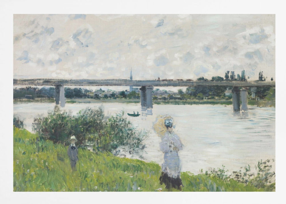 A scenic landscape art print by Claude Monet titled 'The Promenade With the Railroad Bridge, Argenteuil', depicting people on a promenade alongside a body of water with a railroad bridge in the background, characteristic of Impressionist style with soft colors and brushstrokes. Print
