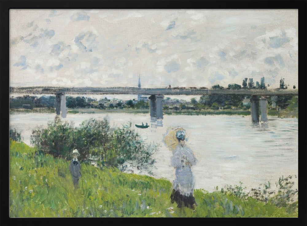 A scenic landscape art print by Claude Monet titled 'The Promenade With the Railroad Bridge, Argenteuil', depicting people on a promenade alongside a body of water with a railroad bridge in the background, characteristic of Impressionist style with soft colors and brushstrokes. Print