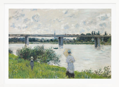 A scenic landscape art print by Claude Monet titled 'The Promenade With the Railroad Bridge, Argenteuil', depicting people on a promenade alongside a body of water with a railroad bridge in the background, characteristic of Impressionist style with soft colors and brushstrokes. Print