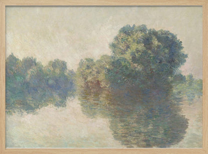 An impressionist painting of lush green trees on a riverbank, their forms blurred and reflected in the calm, hazy water below. The scene is rendered in soft, muted tones, creating a serene and atmospheric quality, and is presented in a simple silver frame. Artwork
