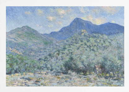 An Impressionist painting by Claude Monet, 'Valle Buona, near Bordighera', showcasing a vast landscape of rolling green hills and deep blue mountains under a light blue sky with wispy clouds. The painting, rendered in soft, textured brushstrokes, is presented in a simple silver frame. Print