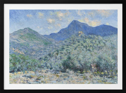 An Impressionist painting by Claude Monet, 'Valle Buona, near Bordighera', showcasing a vast landscape of rolling green hills and deep blue mountains under a light blue sky with wispy clouds. The painting, rendered in soft, textured brushstrokes, is presented in a simple silver frame. Print