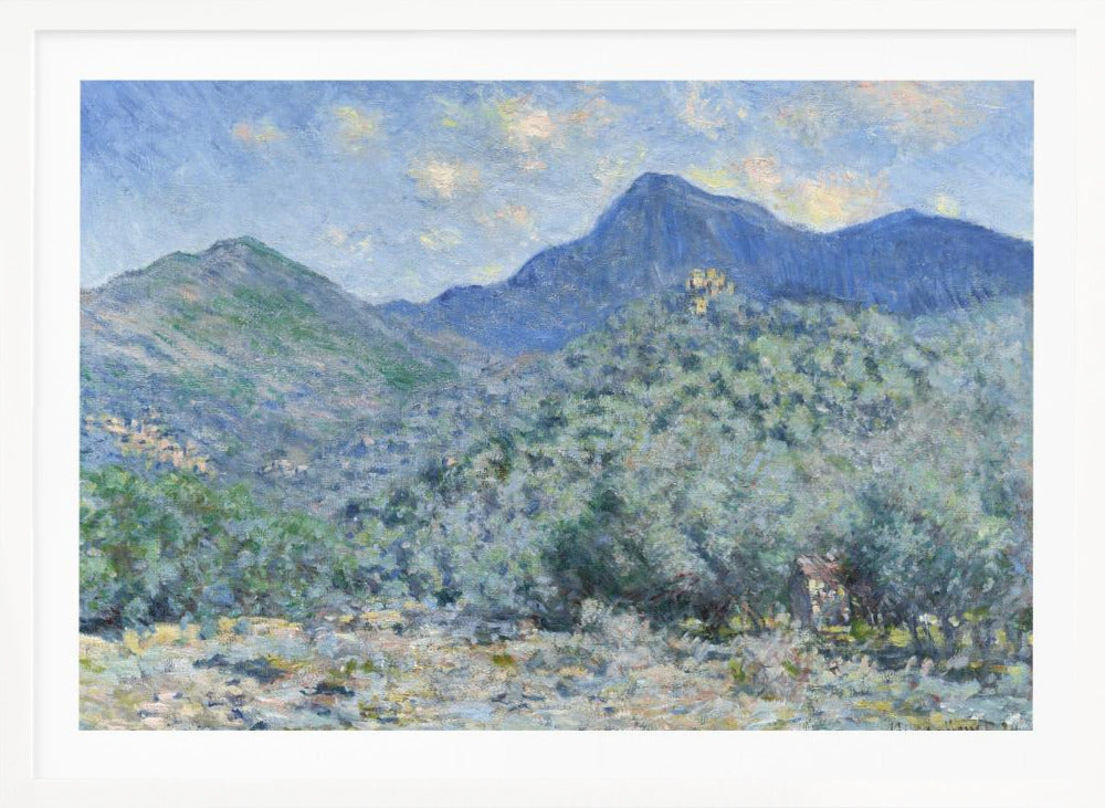 An Impressionist painting by Claude Monet, 'Valle Buona, near Bordighera', showcasing a vast landscape of rolling green hills and deep blue mountains under a light blue sky with wispy clouds. The painting, rendered in soft, textured brushstrokes, is presented in a simple silver frame. Print