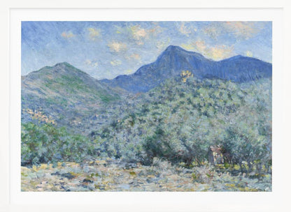An Impressionist painting by Claude Monet, 'Valle Buona, near Bordighera', showcasing a vast landscape of rolling green hills and deep blue mountains under a light blue sky with wispy clouds. The painting, rendered in soft, textured brushstrokes, is presented in a simple silver frame. Print