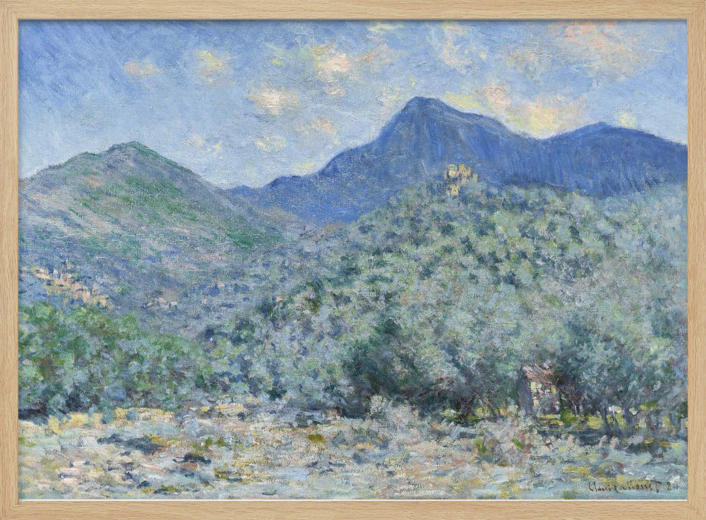 An Impressionist painting by Claude Monet, 'Valle Buona, near Bordighera', showcasing a vast landscape of rolling green hills and deep blue mountains under a light blue sky with wispy clouds. The painting, rendered in soft, textured brushstrokes, is presented in a simple silver frame. Print