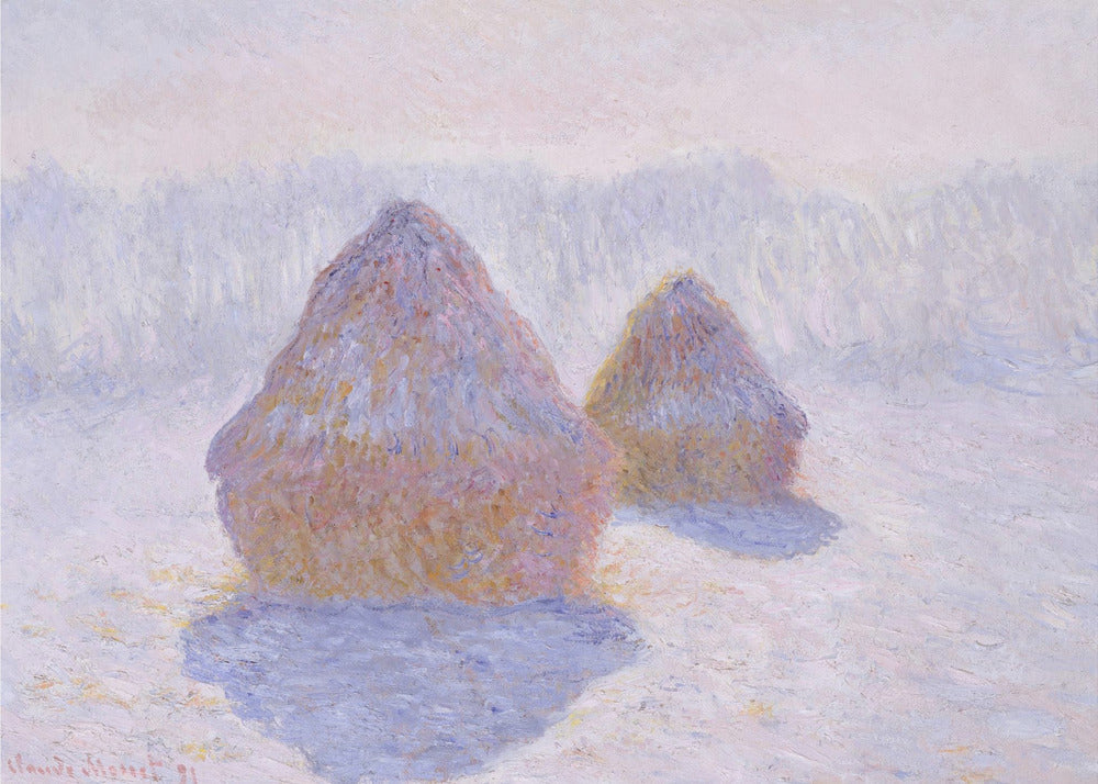 An impressionist painting by Claude Monet titled 'Haystacks,' showing two large, conical haystacks in a snowy field. The scene is bathed in a soft, hazy light, with pinks and oranges on the sunlit side of the haystacks and long, purple shadows cast across the lavender and white snow. The artwork is presented in a simple silver frame. Wall Art