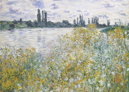 An impressionist landscape painting of a riverbank covered in yellow and white wildflowers. A calm river reflects the cloudy sky, and the opposite bank is lined with tall, dark poplar trees. The artwork is displayed in a silver frame. Artwork