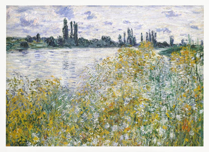 An impressionist landscape painting of a riverbank covered in yellow and white wildflowers. A calm river reflects the cloudy sky, and the opposite bank is lined with tall, dark poplar trees. The artwork is displayed in a silver frame. Artwork