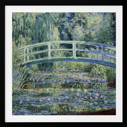An Impressionist painting by Claude Monet, 'The Water Lily Pond', in a light wood frame. A pale green Japanese footbridge arches over a tranquil pond filled with pink and white water lilies, reflecting the lush green and blue foliage of weeping willows that surround it. Poster