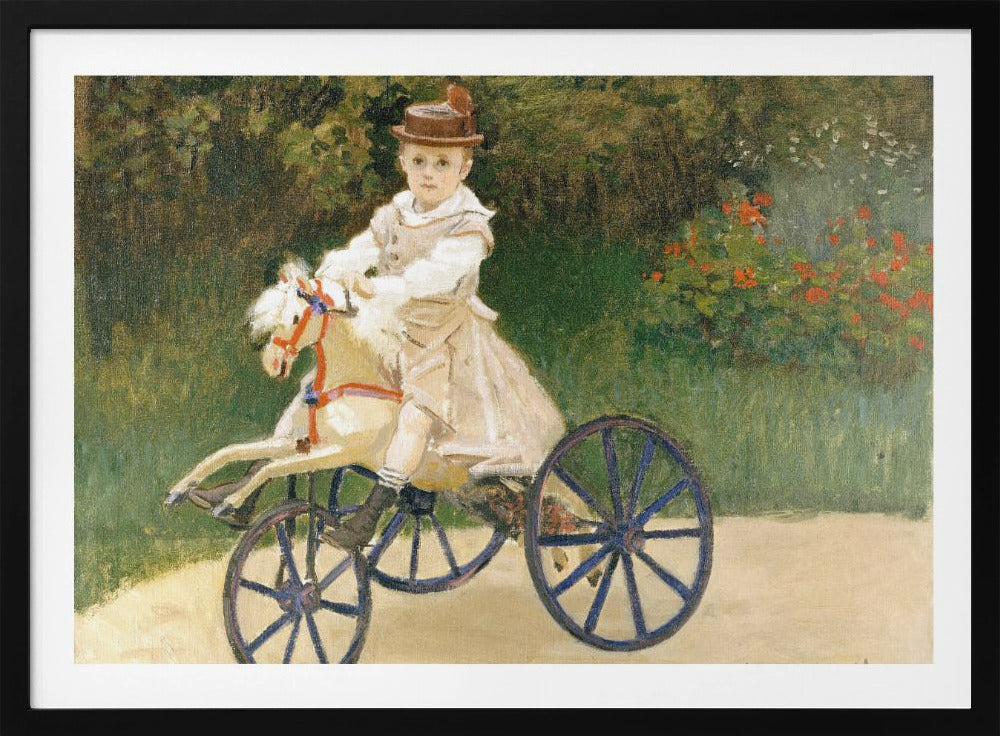 An Impressionist painting by Claude Monet depicting his son, Jean, riding a toy horse tricycle. The young boy wears a brown hat and a light-colored outfit, sitting on a white hobby horse with large blue wheels, set against a lush green garden background. Decor
