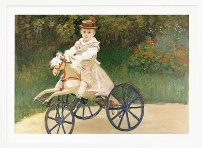 An Impressionist painting by Claude Monet depicting his son, Jean, riding a toy horse tricycle. The young boy wears a brown hat and a light-colored outfit, sitting on a white hobby horse with large blue wheels, set against a lush green garden background. Decor