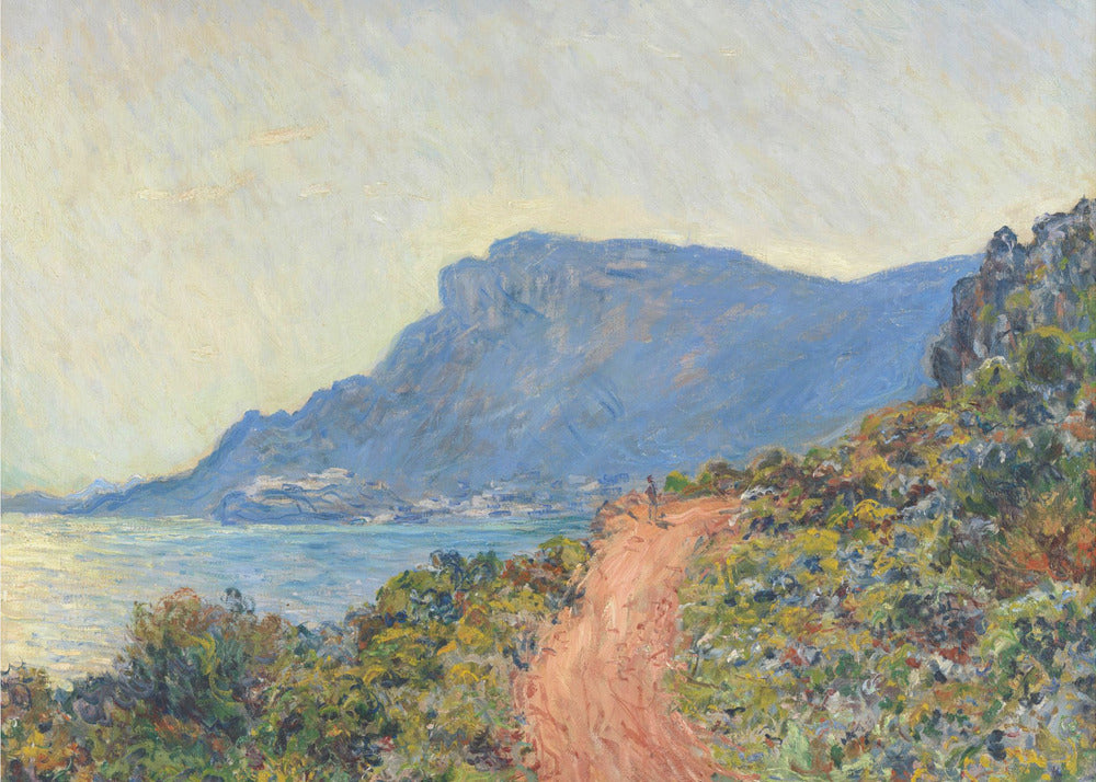 An Impressionist painting by Claude Monet titled 'Cap Martin, near Menton', depicting a sunlit coastal scene. A reddish-brown path winds along a vibrant, brush-covered cliff in the foreground, overlooking the blue Mediterranean Sea. A large, hazy blue mountain dominates the background under a pale yellow sky. Decor