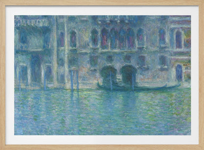 An Impressionist painting by Claude Monet titled 'The Palazzo Contarini,' depicting a grand Venetian building from across a canal. The artwork is characterized by hazy, blended brushstrokes in a cool palette of blues, greens, and purples, creating a misty and atmospheric effect on the water and architecture. A single gondola is moored near the building's entrance. The painting is displayed within a silver frame. Decor