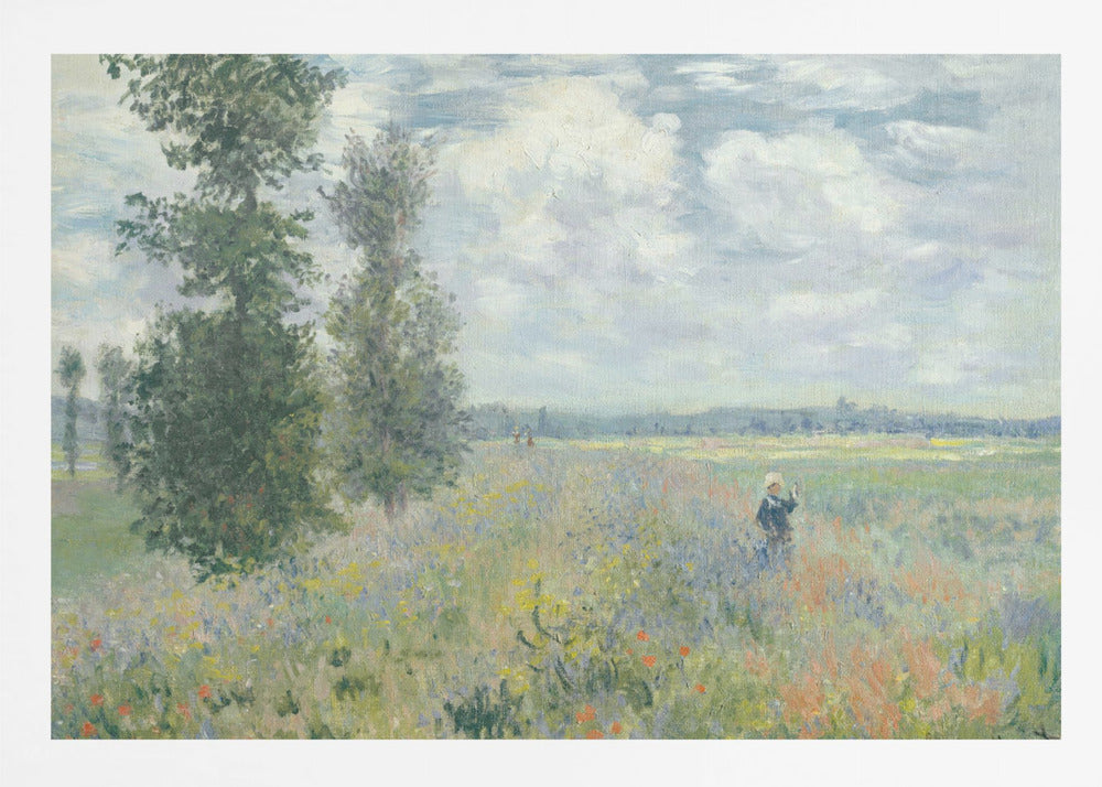 An impressionist painting by Claude Monet titled 'Poppy Field near Vétheuil', depicting a vast field of green grass dotted with red, yellow, and purple wildflowers. A figure in a white bonnet stands in the field to the right. Tall green trees are on the left, under a blue sky with fluffy white clouds. The entire scene is presented within a modern silver frame. Wall Art