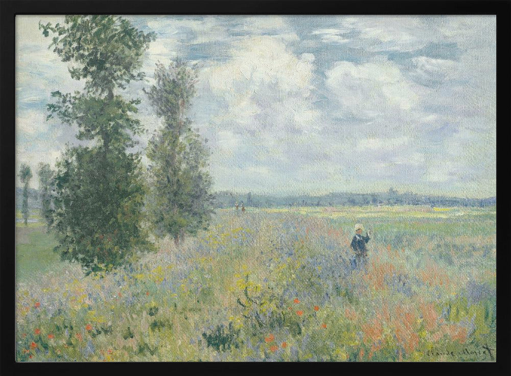 An impressionist painting by Claude Monet titled 'Poppy Field near Vétheuil', depicting a vast field of green grass dotted with red, yellow, and purple wildflowers. A figure in a white bonnet stands in the field to the right. Tall green trees are on the left, under a blue sky with fluffy white clouds. The entire scene is presented within a modern silver frame. Wall Art