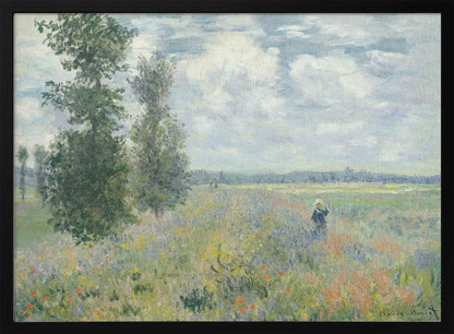 An impressionist painting by Claude Monet titled 'Poppy Field near Vétheuil', depicting a vast field of green grass dotted with red, yellow, and purple wildflowers. A figure in a white bonnet stands in the field to the right. Tall green trees are on the left, under a blue sky with fluffy white clouds. The entire scene is presented within a modern silver frame. Wall Art