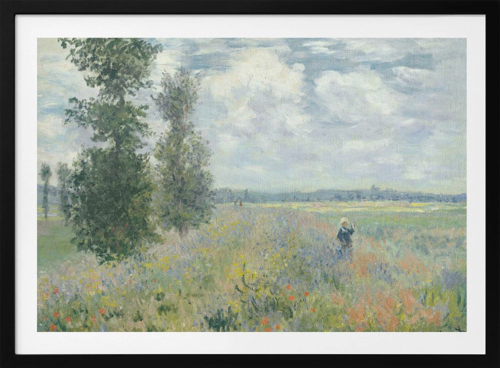 An impressionist painting by Claude Monet titled 'Poppy Field near Vétheuil', depicting a vast field of green grass dotted with red, yellow, and purple wildflowers. A figure in a white bonnet stands in the field to the right. Tall green trees are on the left, under a blue sky with fluffy white clouds. The entire scene is presented within a modern silver frame. Wall Art
