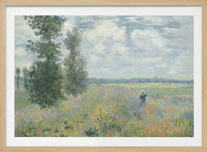 An impressionist painting by Claude Monet titled 'Poppy Field near Vétheuil', depicting a vast field of green grass dotted with red, yellow, and purple wildflowers. A figure in a white bonnet stands in the field to the right. Tall green trees are on the left, under a blue sky with fluffy white clouds. The entire scene is presented within a modern silver frame. Wall Art