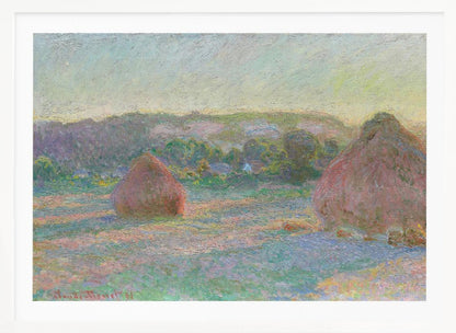 An Impressionist painting by Claude Monet depicting two large, reddish haystacks in a field of green and purple hues during sunrise, with a line of distant trees under a pale yellow sky, all within a silver frame. Poster
