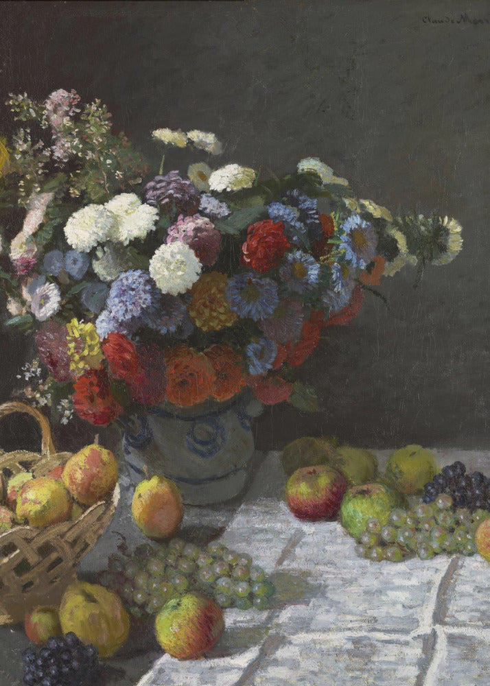 A classic still life painting by Claude Monet depicting a vibrant, multicolored bouquet of flowers in a ceramic vase. Scattered around the vase on a white tablecloth are various fruits, including apples, pears in a basket, and bunches of grapes, all set against a dark, moody background. Poster