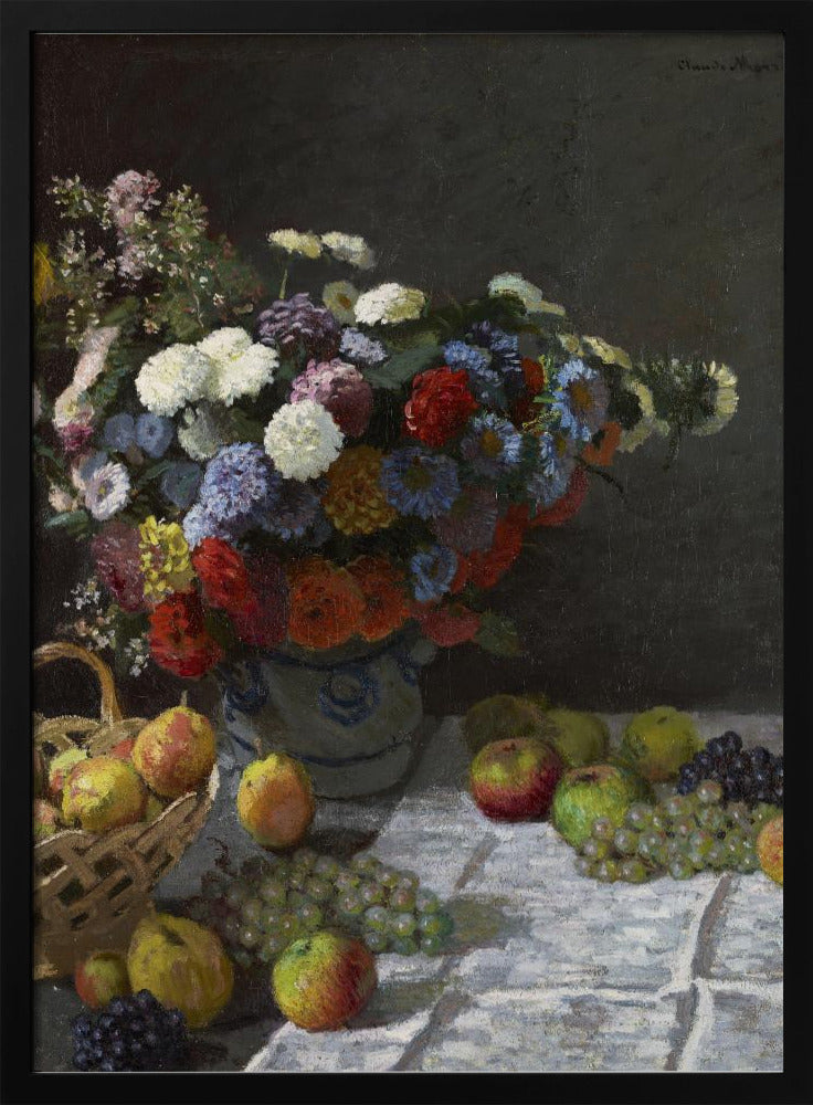 A classic still life painting by Claude Monet depicting a vibrant, multicolored bouquet of flowers in a ceramic vase. Scattered around the vase on a white tablecloth are various fruits, including apples, pears in a basket, and bunches of grapes, all set against a dark, moody background. Poster