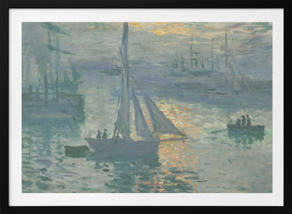A framed print of Claude Monet's famous Impressionist painting, 'Impression, Sunrise'. The artwork depicts a misty harbor scene in muted blue and grey tones. A bright orange sun is visible through the haze, its light reflecting on the water's surface. Several boats, including a prominent sailboat in the foreground, are silhouetted against the dawn light. Print