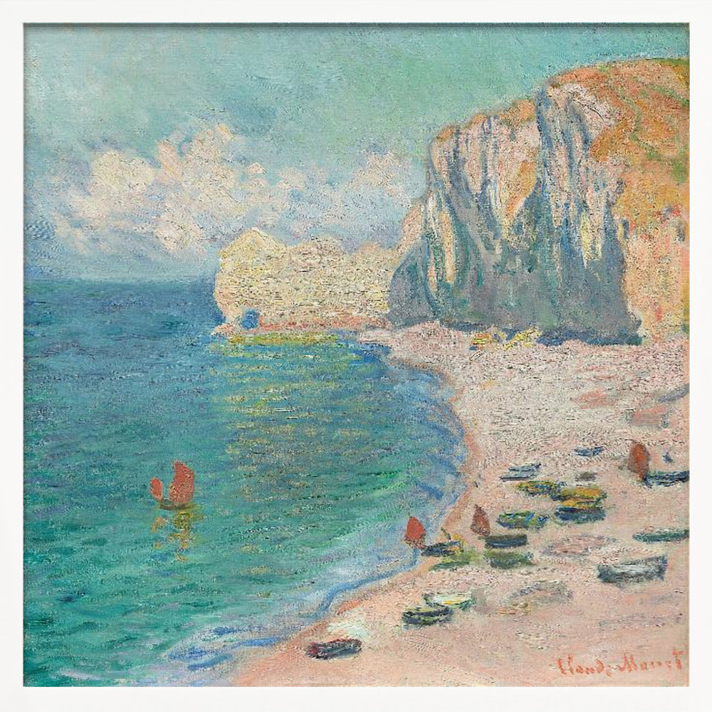 An impressionist painting by Claude Monet depicting the beach at Étretat, France, enclosed in a light wood frame. The artwork shows tall, light-colored cliffs on the right, a sandy beach with small boats, and vibrant turquoise water with a few red-sailed boats. The sky is partly cloudy. Decor