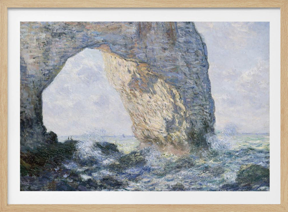 An impressionist painting by Claude Monet of the Manneporte rock arch at Étretat, France. Sunlight illuminates the massive stone arch as turbulent blue and white waves crash against the rocky shoreline below. The artwork is displayed in a silver frame. Decor