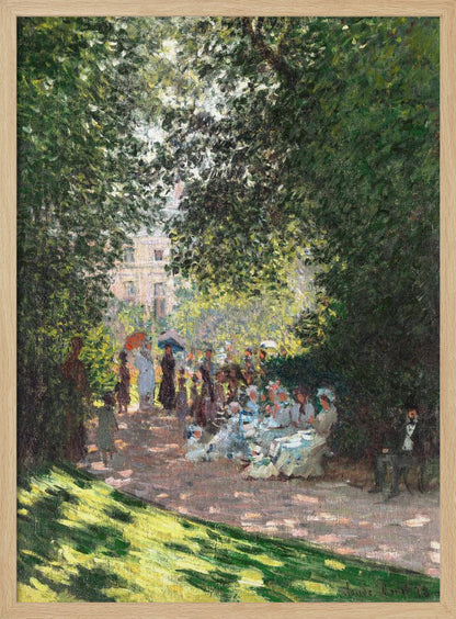 An Impressionist painting of a group of people having a luncheon in a park on a sunny day. Sunlight filters through the dense green leaves of overhead trees, creating a dappled light effect on the figures and the ground. In the background, more people stroll along a path, and a building is visible through the trees. Wall Art
