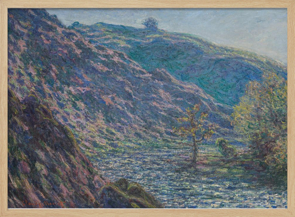 A framed Impressionist painting depicting a river valley. A steep hillside with purple and blue tones dominates the left, while a sun-dappled river flows below. In the distance, gentle green and blue hills rise against a pale sky. Artwork