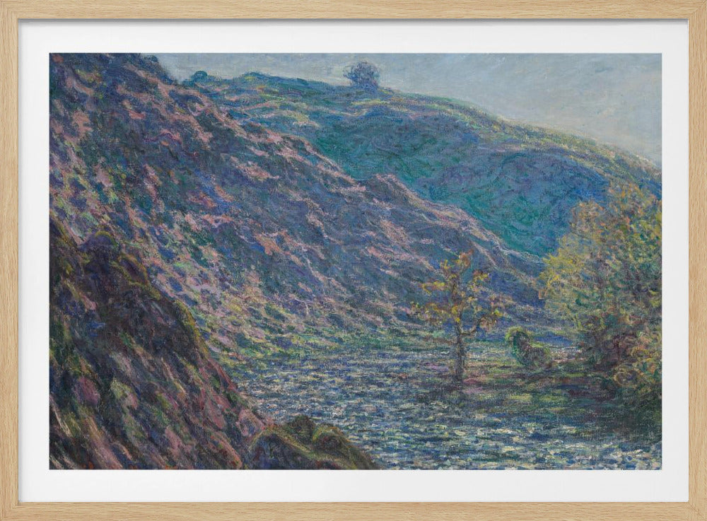 A framed Impressionist painting depicting a river valley. A steep hillside with purple and blue tones dominates the left, while a sun-dappled river flows below. In the distance, gentle green and blue hills rise against a pale sky. Artwork