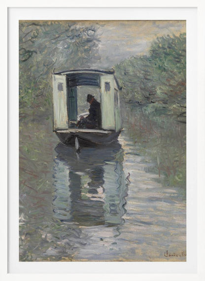 An Impressionist painting by Claude Monet titled 'The Studio Boat,' depicting a figure in a hat and dark coat sitting inside a small, white-paneled boat on a calm, grey-green river. The scene is enveloped in a soft, hazy light, with blurry trees lining the banks and a strong, rippling reflection of the boat in the water. Artwork