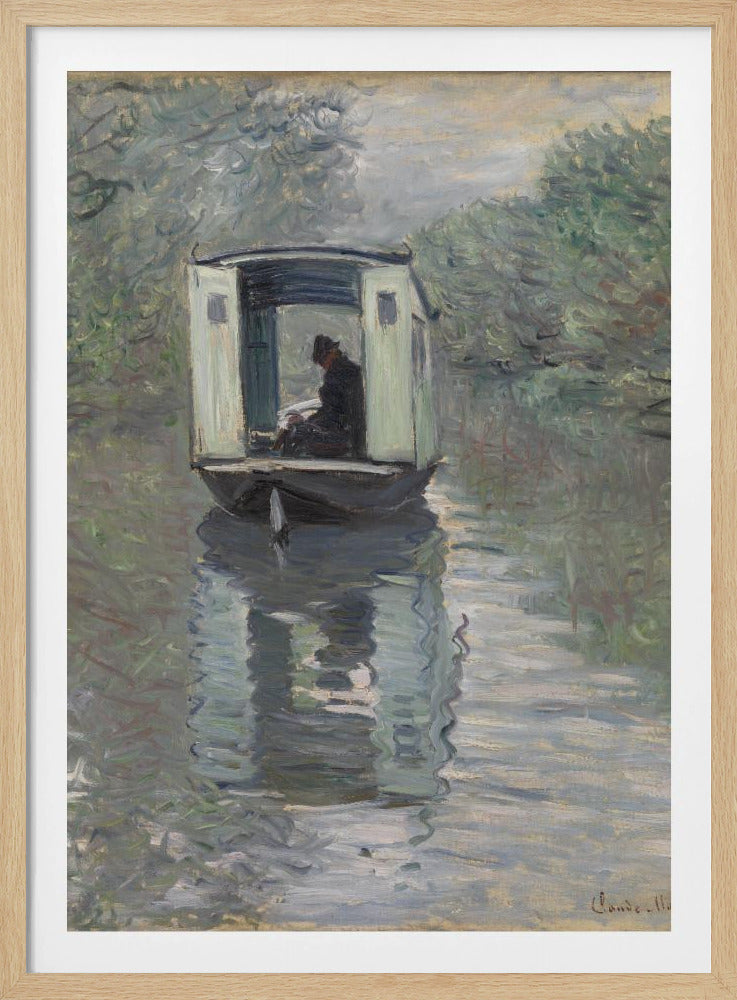 An Impressionist painting by Claude Monet titled 'The Studio Boat,' depicting a figure in a hat and dark coat sitting inside a small, white-paneled boat on a calm, grey-green river. The scene is enveloped in a soft, hazy light, with blurry trees lining the banks and a strong, rippling reflection of the boat in the water. Artwork