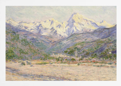 An impressionistic painting of a vast mountain range. The snow-covered peaks are bathed in pale yellow sunlight, while the lower slopes are cast in shades of purple and blue. A wide, beige valley with patches of green foliage sits in the foreground, all rendered with visible, textured brushstrokes and displayed in a silver frame. Print