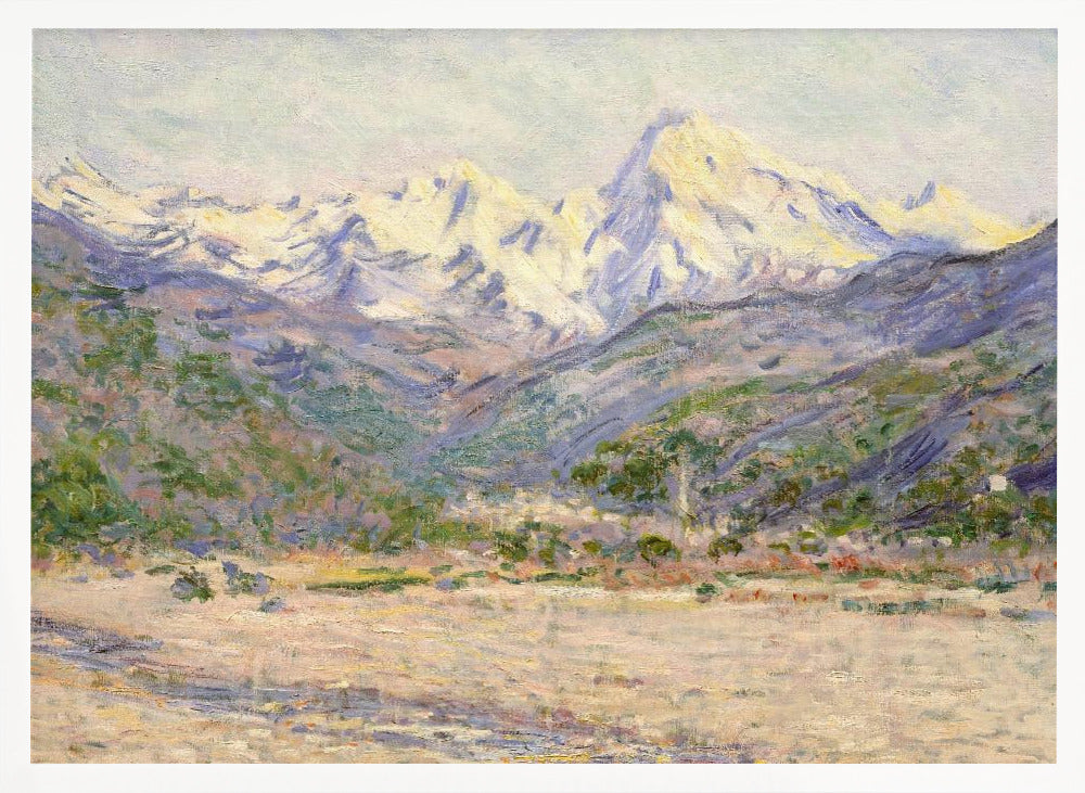 An impressionistic painting of a vast mountain range. The snow-covered peaks are bathed in pale yellow sunlight, while the lower slopes are cast in shades of purple and blue. A wide, beige valley with patches of green foliage sits in the foreground, all rendered with visible, textured brushstrokes and displayed in a silver frame. Print