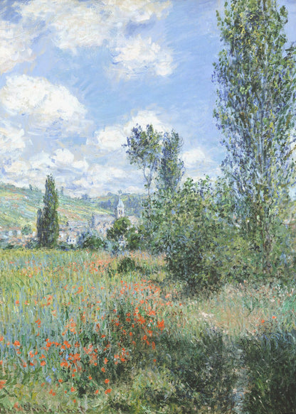An impressionist painting depicting a vibrant green field filled with red poppies under a bright blue sky with fluffy white clouds. Tall green trees stand on the right, and in the distance, a small village with a church steeple is nestled in the rolling hills. Decor