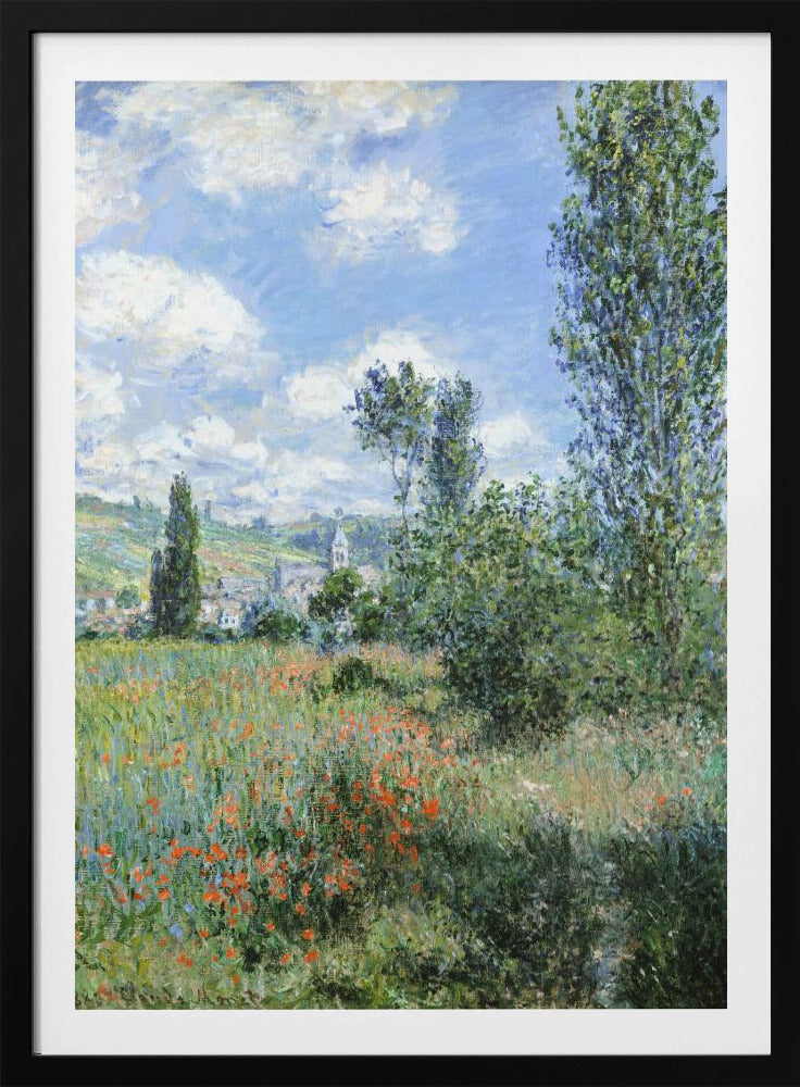 An impressionist painting depicting a vibrant green field filled with red poppies under a bright blue sky with fluffy white clouds. Tall green trees stand on the right, and in the distance, a small village with a church steeple is nestled in the rolling hills. Decor