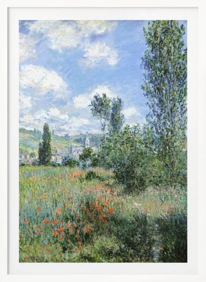 An impressionist painting depicting a vibrant green field filled with red poppies under a bright blue sky with fluffy white clouds. Tall green trees stand on the right, and in the distance, a small village with a church steeple is nestled in the rolling hills. Decor