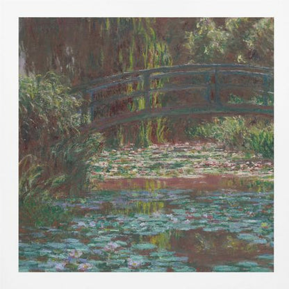 An impressionist painting by Claude Monet of the Japanese bridge over his water lily pond. The artwork, framed in light wood, is rich with shades of green from the foliage and lily pads, and deep brown and blue tones in the water and the bridge itself. Wall Art