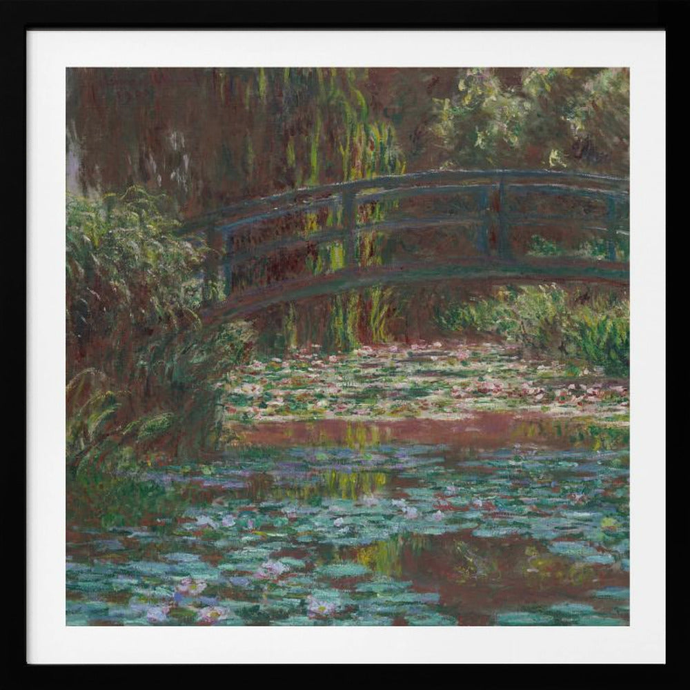 An impressionist painting by Claude Monet of the Japanese bridge over his water lily pond. The artwork, framed in light wood, is rich with shades of green from the foliage and lily pads, and deep brown and blue tones in the water and the bridge itself. Wall Art