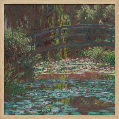 An impressionist painting by Claude Monet of the Japanese bridge over his water lily pond. The artwork, framed in light wood, is rich with shades of green from the foliage and lily pads, and deep brown and blue tones in the water and the bridge itself. Wall Art