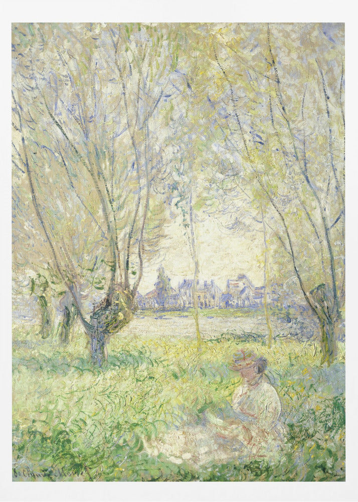 An Impressionist painting, 'Springtime' by Claude Monet, showing a woman in a hat sitting in a sunlit green field. Slender trees with light green foliage frame a view of a village across a river, evoking a peaceful spring day. The artwork is presented in a simple black frame. Artwork
