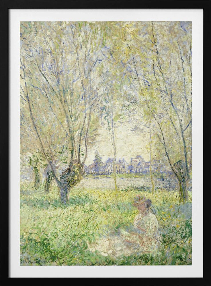 An Impressionist painting, 'Springtime' by Claude Monet, showing a woman in a hat sitting in a sunlit green field. Slender trees with light green foliage frame a view of a village across a river, evoking a peaceful spring day. The artwork is presented in a simple black frame. Artwork